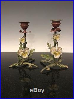 A Pair Of Vintage Cold Painted Floral Decorated Candlesticks