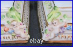 Continental porcelain vintage Victorian antique pair of figural candlesticks