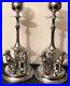 Pair-Vintage-Chrome-Plated-Candlesticks-3-Greyhound-Whippets-seated-At-Base-01-xnsd
