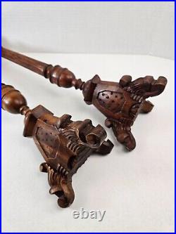 Pair of antique hand carved wooden candlestick holders used in church alter