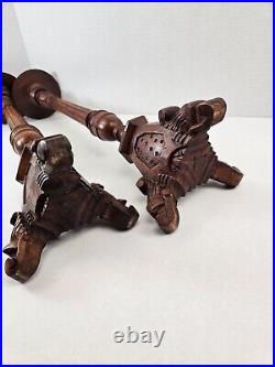 Pair of antique hand carved wooden candlestick holders used in church alter