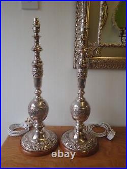 Pair of vintage silver plated embossed church candlestick table lamps