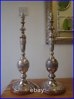 Pair of vintage silver plated embossed church candlestick table lamps