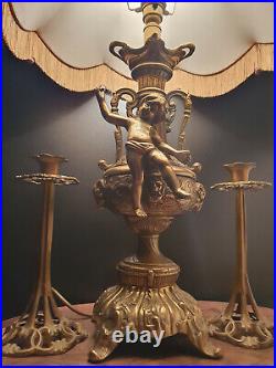 Vintage Brass Lamp with Cherub Sculpture with pair of brass candlesticks