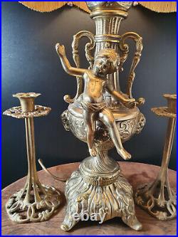 Vintage Brass Lamp with Cherub Sculpture with pair of brass candlesticks