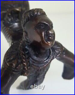 Vintage Chinese bronze figural candlestick in the manner of an acrobat