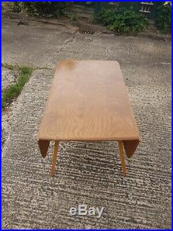 Vintage Ercol table & 4 chairs. Includes pair of Candlestick chairs