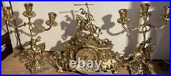 Vintage brass Clock on horseback clock and 2 X candle sticks set of 3