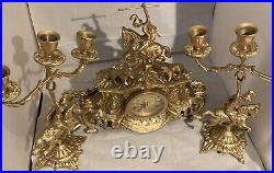 Vintage brass Clock on horseback clock and 2 X candle sticks set of 3