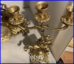 Vintage brass Clock on horseback clock and 2 X candle sticks set of 3